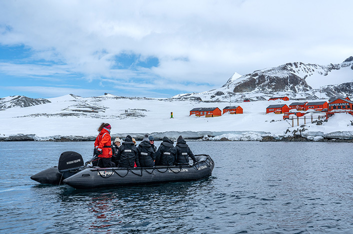 Scenic Eclipse guests in a Zodiac headed to the shore