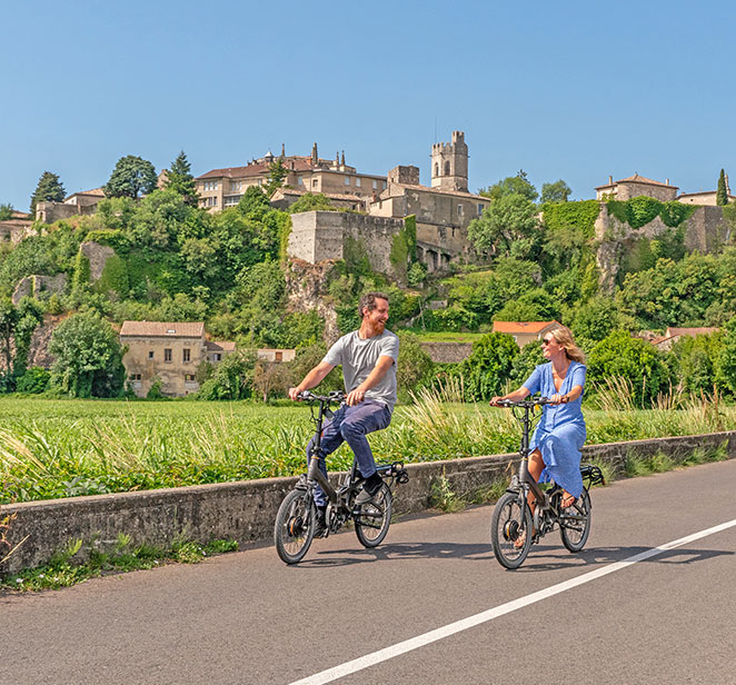 Scenic guests riding e-bikes through Viviers, France
