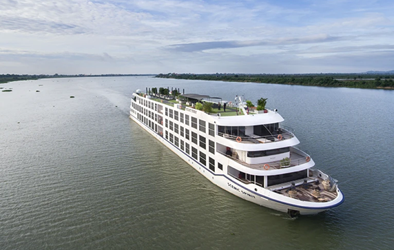 Scenic Spirit ship on the Mekong River with a blue sky above 