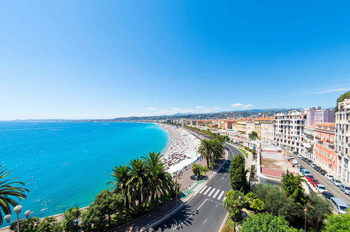 Promenade with bight blue water and nice building in Nice 