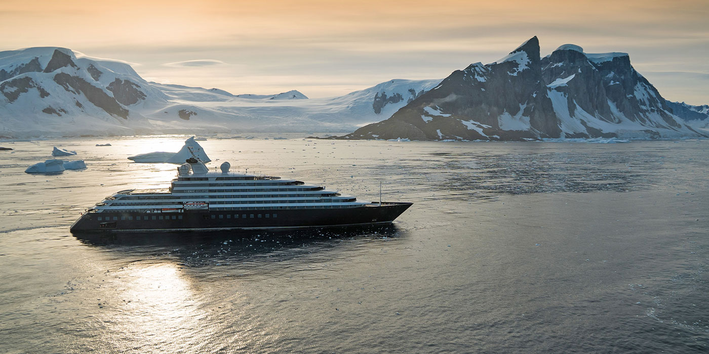 Scenic Eclipse sailing at sunrise off Yalour Island, Antarctica